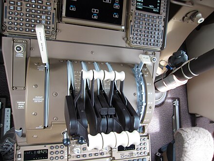 Reverse thrust levers forward of the main levers, seen on a Boeing 747-8