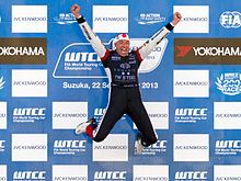 Tom Coronel celebrating his victory in Race Two Tom Coronel jumping on the podium 2013 WTCC Race of Japan.jpg