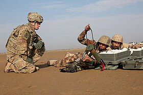 A U.S. Army Soldier advises & assists Iraqi soldiers during a training exercise at Besmaya Range Complex, Iraq, 10 November 2015 U.S. Army advise and assist soldier Iraq Nov 2015.jpeg