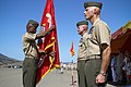 U. S. Marine Sergeant Major Angelo R. Scott, the sergeant major of 1st Battalion, 4th Marine Regiment, hands the battalion colors to Lt. Col. Kevin A. Norton, who relinquished command of the battalion to Maj 120906-M-XZ164-015.jpg