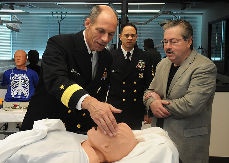 File:US Navy 090424-N-9824T-001 Rear Adm. Michael Franken, left, and Yeoman Chief Jose Soto listen as Des Moines University President Terry E. Branstad gives a tour of the school's Simulation Lab during Des Moines Navy Week.jpg