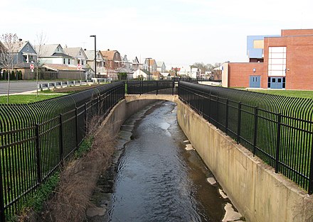 Weasel Brook in Passaic, New Jersey has been channelized with concrete walls to control localized flooding.
