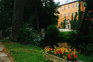 Front view of the moated castle Weißdorf with moat and entrance portal