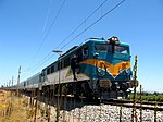 A test passenger train behind an electric locomotive in Chile in 2008