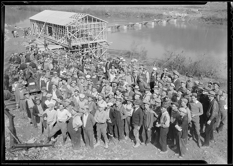 File:"A group showing some of the men working at Norris Dam site. In the rear can be seen the warehouse under construction... - NARA - 532716.jpg