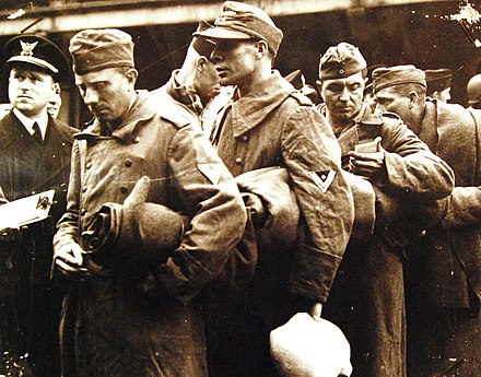 German prisoners board a Coast Guard transport after being captured in Normandy