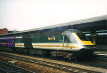 First Great Western HST at Reading railway station in two former First Great Western liveries: Fag Packet on the power car and Barbie on the coaches