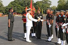 Robin K. Dhowan, Chief of Naval Staff for India, reviews cadets during a passing out parade of the Indian Military Academy. The institution is a training academy of the Indian Army. Admiral RK Dhowan reviewing the Passing Out Parade at the Indian Military Academy, Dehradun 01.JPG