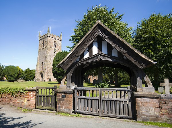 Lychgate and west tower of All Saints' parish church.