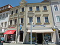 Residential building with shop (original front) in closed development