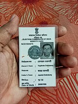 An paper Laminated Indian Voter Identity Card An Indian holding a Voter Identity Card, photo taken by Yogabrata Chakraborty, on July 9, 2023.jpg