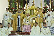 Archbishop Jose S. Palma with his assistant ministers during Pontifical High Mass Archbishop Jose Palma delivering his homily.jpg