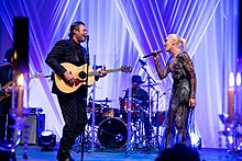 A color picture of singer Gwen Stefani and Blake Shelton performing at the US-Italy State Dinner in October 2016.