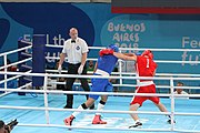 Deutsch: Boxen bei den Olympischen Jugendspielen 2018 Tag 12, 18. Oktober 2018 - Kampf um die Bronzemedaille im Fliegengewicht Mädchen – Timur Merjanow (Usbekistan, rot) schlägt Youssef Ali Karar Ali (Ägypten, blau) 5-0; Ringrichter ist Antonín Gaspar (Tschechien). English: Boxing at the 2018 Summer Youth Olympics on 18 October 2018 – Boy's heavyweight Bronze Medal Bout - Timur Merjanov (Uzbekistan, red) beats Youssef Ali Karar Ali (Egypt, blue) 5-0; Referee is Antonín Gaspar (Czech Republic). Español: Boxeo en los Juegos Olímpicos Juveniles de Verano de 2018 en 18 de octubre de 2018 - Medalla de bronce de peso pesado del muchacho: Timur Merjanov (Uzbekistán, roja) le gana a Youssef Ali Karar Ali (Egipto, azul) 5-0; El árbitro es Antonín Gaspar (Republica checa).