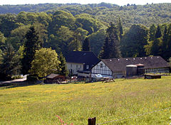 View of Burgholz woods with typical Bergisches farmerhouse