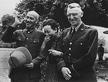 Chiang and his wife Soong Mei-ling sharing a laugh with U.S. Lieutenant General Joseph W. Stilwell, Burma, April 1942 Chiang Kai Shek and wife with Lieutenant General Stilwell.jpg