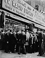 Crowd listens outside radio shop in New York for news on President Kennedy