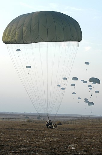 U.S. Army paratroopers with the 82nd Airborne Division parachute from a C-130 Hercules aircraft during Operation Toy Drop 2007 at Pope Air Force Base.