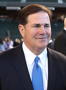 Doug Ducey with Honor Guard (51809476861) (cropped).jpg