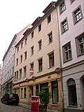 Residential house in closed development and rear building