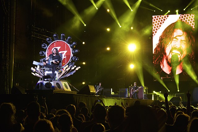 Dave Grohl performing with a broken leg on the Sonic Highways World Tour.