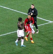 Nakye Greenidge-Duncan exchanges jerseys with Rohan Goulbourne in 2023 Goulbourne and NGD.jpg