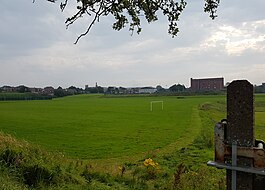 Playing fields of Hathershaw College, the college buildings are in the centre background Hathershaw College playing fields.jpg