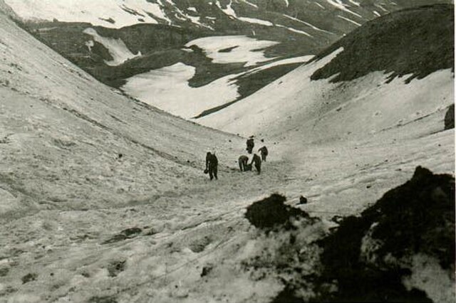 American troops hauling supplies through Jarmin Pass on Attu in May 1943. Their vehicles could not move across the island's rugged terrain.