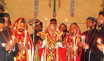 A West Syriac Rite liturgy of the Syriac Orthodox Church holding paterissa (crozier) Holy mass of the Syriac Orthodox Church.jpg