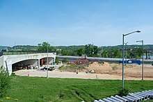 Looking southwest from Barney Circle along John Philip Sousa Bridge in May 2014 at the now-unused Interstate 695 as it passes beneath the bridge's northern approaches. Construction on the new "Southeast Boulevard" is under way. I-695 underpass deconstruction - Washington DC.jpg