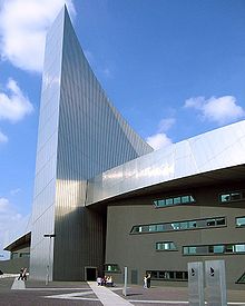 The entrance to Imperial War Museum North, at the base of the air shard tower. ImperialWarMuseumNorth02Trim.jpg