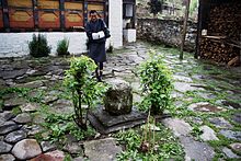 Courtyard of Konchogsum Lhakhang in Bumthang, where Pema Lingpa is said to have placed this stone plug over the subterranean lake below the temple KonchogsumLhakhang.jpg