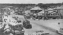 Koza Crossing, Okinawa, circa 1955. Cars drive on the right. Koza Crossroads in 1950s.JPG