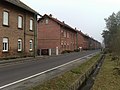 Seven double tenement houses in a miners' settlement