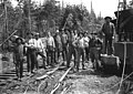 Logging crew standing near steam donkey engine and railroad tracks, Washington, 1909-1910 (INDOCC 1419).jpg