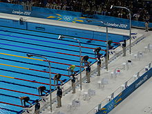 One of the heats during the qualification London 2012 Olympics Aquatics Centre.jpg