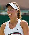 Mandy Minella competing in the second round of the 2015 Wimbledon Qualifying Tournament at the Bank of England Sports Grounds in Roehampton, England. The winners of three rounds of competition qualify for the main draw of Wimbledon the following week.