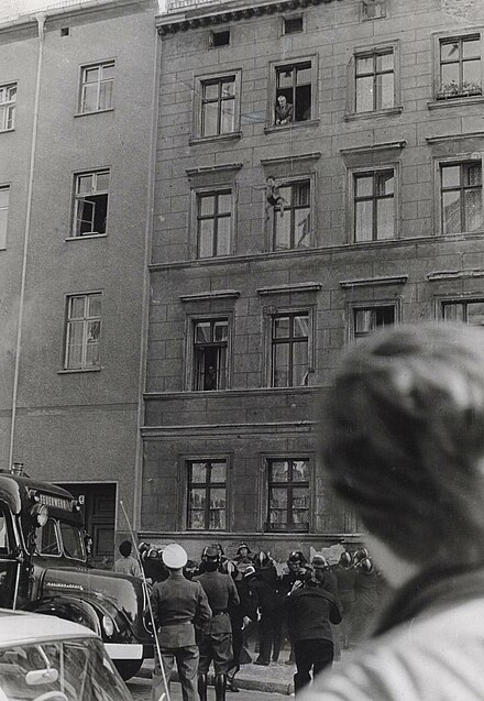 October 7, 1961. Four-year-old Michael Finder of East Germany is tossed by his father into a net held by residents across the border in West Berlin. The father, Willy Finder, then prepares to make the jump himself.