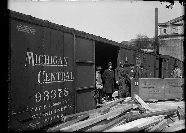 Loading dock with a Michigan Central boxcar in 1920