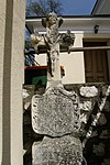 Other small monuments, baroque tombstone and three stone putti