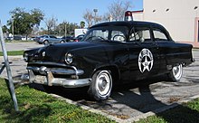 A 1953 Ford formerly used by the New Orleans Police Department NOLAPoliceFord54Frontleft.jpg