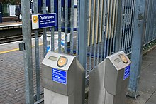 Standalone Oyster readers provided at interchange stations between National Rail and the Tube Oystercard readers.jpg