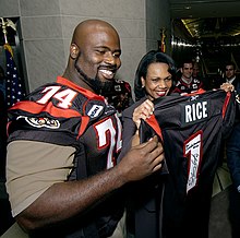 Scott presents an Ottawa Renegades jersey to U.S. Secretary of State Condoleezza Rice at the American Embassy in 2005. Presentation of Canadian Football League Team Jersey.jpg