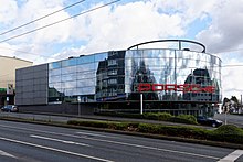 Statt des Fischerhauses heute das Porsche-Zentrum