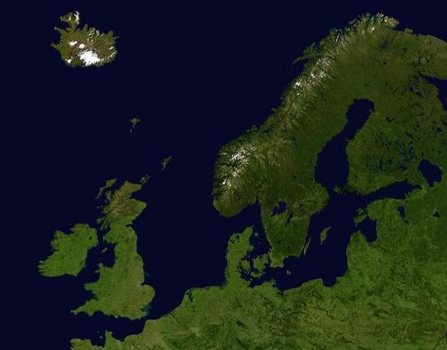 A composed satellite photograph of islands and continental areas in and surrounding the North Sea and Baltic Sea.