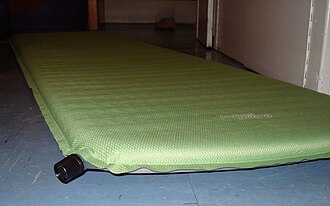 An example of a self-inflating mattress made from diamond ripstop. The black high-volume valve can be seen in the left foreground. Self-inflating mat.jpg