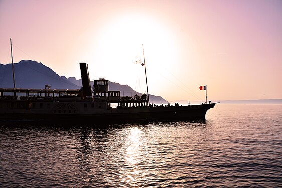 a ship in the sunset on Lake Geneva