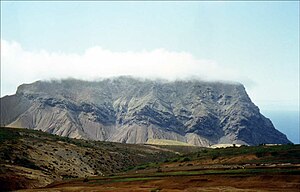 The Barn is a capping of younger lavas upon weaker rocks. The Barn features cliffs on the side that faces the sea. It overlooks the pyroclasts and weak flows of Turk's Cap Valley to the south. St-Helena-The Barn.jpg