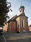 `Erst in den Jahren 1732 bis 1735 wurde die Kirche in ihrer heutigen Form errichtet. Sie ist mit ihrem weithin sichtbaren barocken Zwiebelturm das Wah...