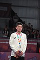Deutsch: Tischtennis bei den Olympischen Jugend-Sommerspielen 2018: Tag 4, 10. Oktober 2018, Jungen-Einzel, Siegerehrung - Gold: Wang Chuqin (CHN), Silber: Tomokazu Harimoto (JPN), Bronze: Kanak Jha (USA); Medaillen überreicht durch IOC-Mitglied William Frederick Blick (UGA), Maskottchen überreicht durch ITTF-Präsident Thomas Weickert (GER) English: Fencing at the 2018 Summer Youth Olympics at 10 October 2018 –Boys' single medail ceremony – Gold: Wang Chuqin (CHN), Silber: Tomokazu Harimoto (JPN), Bronze: Kanak Jha (USA)); Medal presenter: IOC member William Frederick Blick (UGA), Mascot presenter: ITTF President Thomas Weickert (GER)